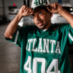 Deante’ Hitchcock’s Independent Quest To Sell 100K Copies Of “Junkie In The Sun” 